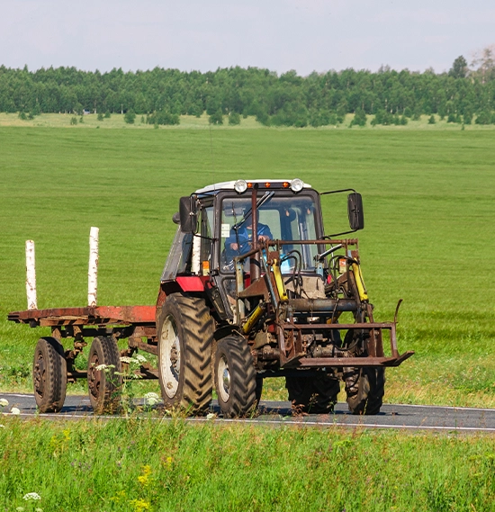 Farmer in tractor on field